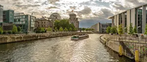 View of sightseeing cruise boat on River Spree and the Reichstag (German Parliament building), Mitte, Berlin, Germany, Europe
