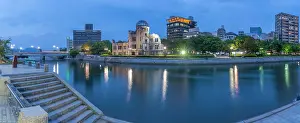 Resilience Prints: View of the skeletal ruins of the A-Bomb Dome from Hiroshima Peace Gardens at dusk