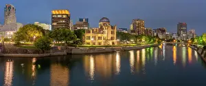 Resilience Prints: View of the skeletal ruins of the A-Bomb Dome from Hiroshima Peace Gardens at dusk