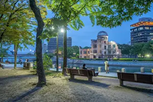 Resilience Prints: View of the skeletal ruins of the A-Bomb Dome from Hiroshima Peace Gardens at dusk