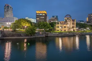 Resilience Prints: View of the skeletal ruins of the A-Bomb Dome from Hiroshima Peace Gardens at dusk