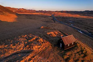 View from above of the small black wooden church of krysuvikurkirkja, at sunrise, Krysuvik, Hafnarfjardarkaupstadur municipality, Reykjanes peninsula, Capital region, Iceland, Polar Regions