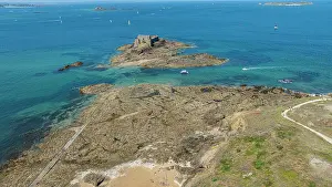 Watercraft Prints: View of a small fortress on an island with rocky coast and boats near Saint-Malo in Brittany