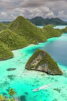 A view from on top of the small islets of the natural protected harbor in Wayag Bay, Raja Ampat, Indonesia, Southeast Asia, Asia