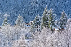 Cottages Prints: View of snow covered chalets, trees and mountains from Dolonne in winter