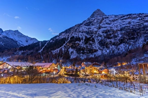 Courmayeur Prints: View of snow covered mountains and Dolonne at dusk in winter