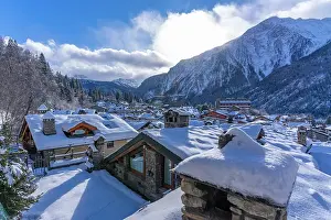Courmayeur Prints: View of snow covered mountains and rooftops in Courmayeur in winter