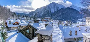Courmayeur Prints: View of snow covered mountains and rooftops in Courmayeur in winter