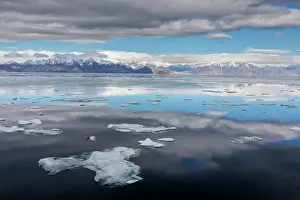 Nunavut Prints: A view of the snow covered mountains surrounding Pond Inlet