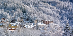 Courmayeur Prints: View of snow covered trees and Courmayeur from Dolonne in winter