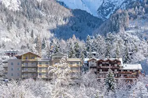 Courmayeur Prints: View of snow covered trees, mountains and Courmayeur from Dolonne in winter