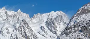 Courmayeur Prints: View of snow covered trees, mountains and Courmayeur from Dolonne in winter