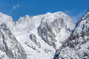 Courmayeur Prints: View of snow covered trees, mountains and Courmayeur from Dolonne in winter