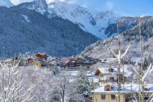 Courmayeur Prints: View of snow covered trees, mountains and Dolonne from Courmayeur in winter