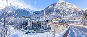 Courmayeur Prints: View of snow covered trees, mountains and Dolonne from Courmayeur in winter