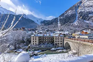 Courmayeur Prints: View of snow covered trees, mountains and Dolonne from Courmayeur in winter