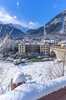 Courmayeur Prints: View of snow covered trees, mountains and Dolonne from Courmayeur in winter