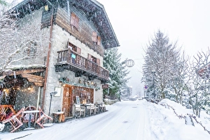 Aosta Prints: View of snow covered wooden houses in Entreves in winter