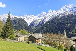 Soglio Prints: View of Soglio between meadows and snowy peaks in spring, Maloja, Bregaglia Valley