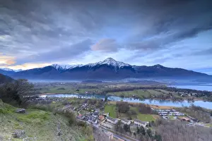 View of Sorico at dawn framed by Lake Como and snowy peaks seen from Chiesa Di San Miro