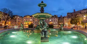 Fountains Prints: View of South fountain of Rossio in Praca do Rossio at dusk, Lisbon, Portugal, Europe