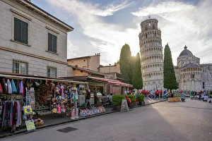 View of souvenir stalls and Leaning Tower of Pisa at sunset, UNESCO World Heritage Site, Pisa, Province of Pisa, Tuscany, Italy, Europe