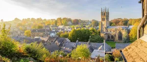 District Prints: View of St John the Baptist Church surrounded by autumn colors in Tideswell
