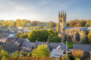United Prints: View of St John the Baptist Church and Tideswell during autumn in the Peak District