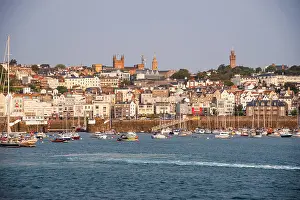 Yachts Prints: View of St Peter Port with boats in harbor during morning light in Guernsey