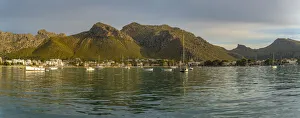 Majorca Prints: View of sunrise reflecting on hotels and bars in Port de Pollenca