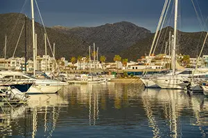 Majorca Prints: View of sunrise reflecting on yachts in Port de Pollenca Marina