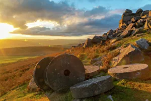 Derbyshire Prints: View of sunset and old millstones at Curbar Edge during autumn, Derbyshire, Peak