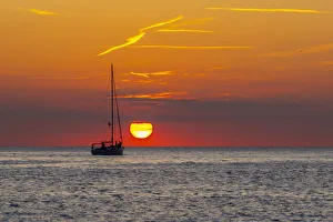 Rovinj Prints: View of sunset and sailboat on Adriatic Sea from the old town, Rovinj, Istria, Croatia