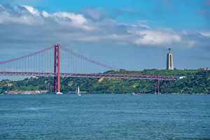 Riverfront Prints: View of Tagus river and 25 April Bridge on a sunny day, Lisbon, Portugal, Europe