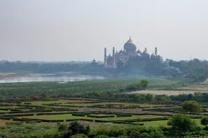 Iconic Prints: View of Taj Mahal from Agra Fort showcasing the iconic structure surrounded by landscape in Agra