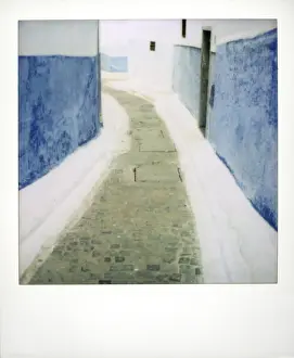 Rabat Prints: View taken on Polaroid down narrow street showing traditional