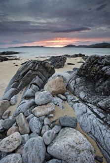 View towards Taransay at sunset from the rocky shore at Scarista, Isle of Harris