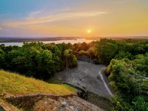 Escape Prints: View from Temple 216 at East Acropolis overlooking Yaxha Lake during sunset in Peten