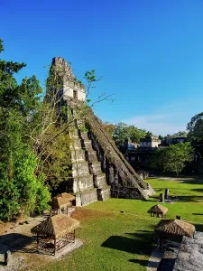Center Prints: View of Temple I in the Great Plaza at Tikal with surrounding structures and greenery in Peten