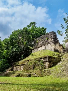 Sites Prints: Back view of Temple of the Skulls surrounded by trees in Tikal, Guatemala