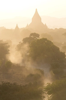Shwesandaw Paya Prints: View over the temples of Bagan swathed in dust and evening sunlight