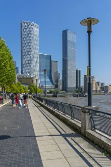 Young Man Prints: View of Thames Path and Canary Wharf, Limehouse, London, England, United Kingdom, Europe