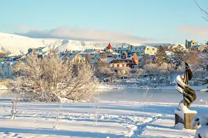 Clothing Prints: View of Tjornin park, town and mountains on a sunny day in winter, Reykjavik, Iceland
