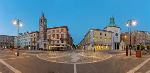 Rimini Prints: View of Torre dell'Orologio and Dei Paolotti Church in Piazza Tre Martiri at dusk