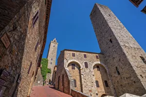 San Gimignano Prints: View of towers from street level in San Gimignano
