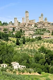 View to town across agricultural landscape, San Gimignano, UNESCO World Heritage Site