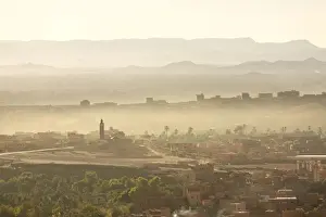 Haze Prints: View over the town of Tinerhir soon after sunrise showing smoke rising from the streets