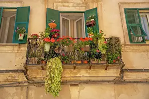 Piazza Duomo Prints: View of traditional balcony with flowers Piazza Duomo in Sassari