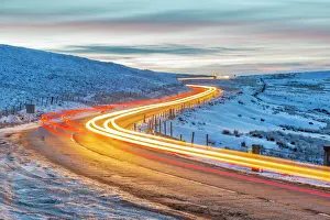 Tail Light Prints: View of trail lights on frozen landscape near Buxton at dusk, High Peak, Derbyshire