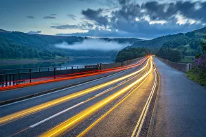 Road Marking Prints: View of trail lights on Ladybower Reservoir bridge at dusk, Peak District National Park